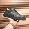 Philipp Plein black real python leather lo-top sneakers.
