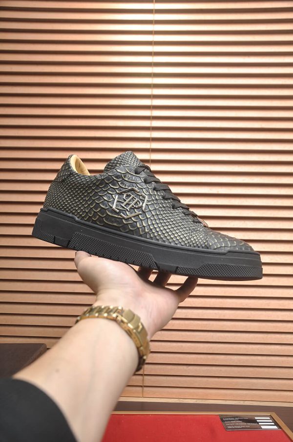 Philipp Plein black real python leather lo-top sneakers.