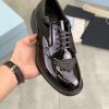 Prada black patent-leather derby shoe.