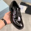 Prada black patent-leather derby shoe. (1) Prada black patent-leather derby shoe.