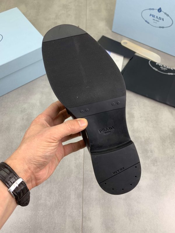 Prada black patent-leather derby shoe. (1) Prada black patent-leather derby shoe.