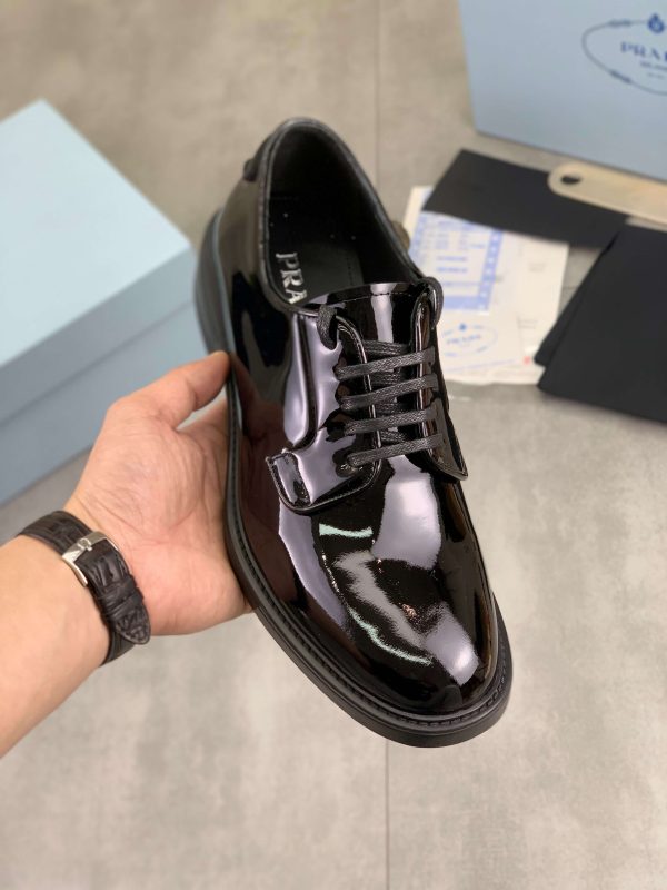 Prada black patent-leather derby shoe. (1) Prada black patent-leather derby shoe.