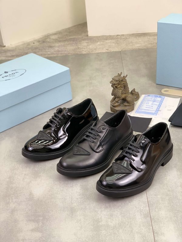 Prada black patent-leather derby shoe.