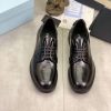 Prada black patent-leather derby shoe.