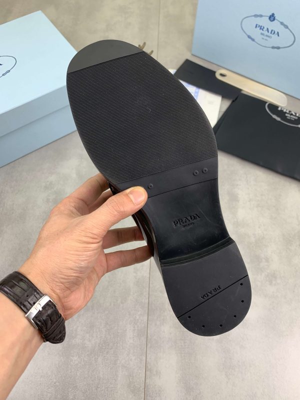 Prada black patent-leather derby shoe. (2) Prada black patent-leather derby shoe.