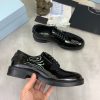 Prada black patent-leather derby shoe. (5) Prada black patent-leather derby shoe.
