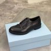 Prada black patent-leather derby shoe. (5) Prada black patent-leather derby shoe.