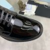 Prada black patent-leather derby shoe. (6) Prada black patent-leather derby shoe.