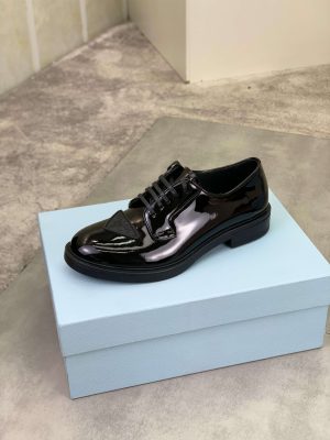 Prada black patent-leather derby shoe. (7) Prada black patent-leather derby shoe.