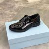 Prada black patent-leather derby shoe. (7) Prada black patent-leather derby shoe.