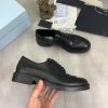 Prada black patent-leather derby shoe. (7) Prada black patent-leather derby shoe.