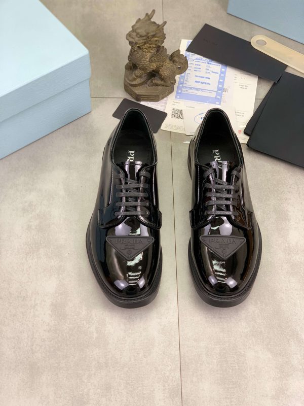Prada black patent-leather derby shoe.