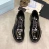 Prada black patent-leather derby shoe. (9) Prada black patent-leather derby shoe.
