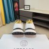 Versace Jeans Couture white and gold Barocco-print low-top sneakers.