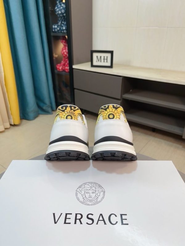 Versace Jeans Couture white and gold Barocco-print low-top sneakers.