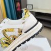 Versace Jeans Couture white and gold Barocco-print low-top sneakers.