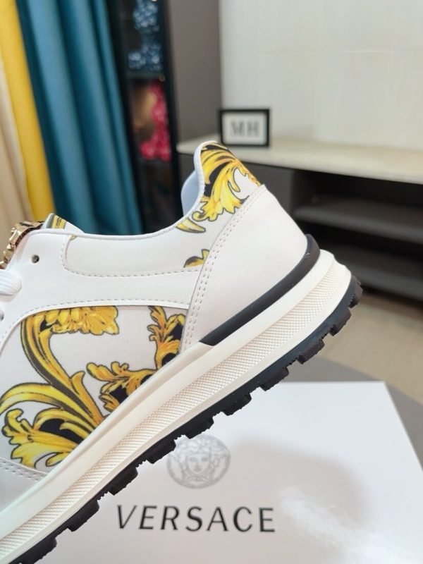 Versace Jeans Couture white and gold Barocco-print low-top sneakers.