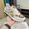 Versace Jeans Couture white and gold Barocco-print low-top sneakers.