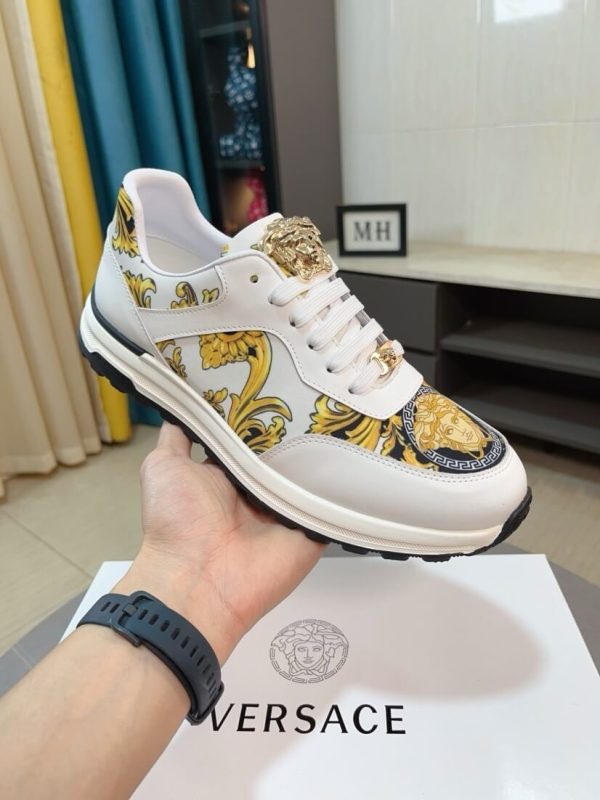 Versace Jeans Couture white and gold Barocco-print low-top sneakers.