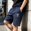 Off-White Diag Stencil Sweatshorts- Black with white and pink accents.