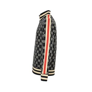 Side profile view of a Gucci track jacket showing the distinctive red and ivory athletic stripe extending down the sleeve.