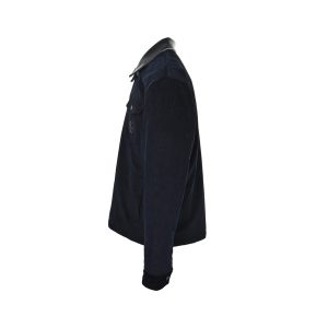 Side profile view of a dark navy Gucci corduroy jacket showing the buttoned cuffs and textured fabric.