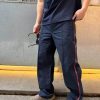 Front view of the Gucci Technical Panama Sportswear Trousers in Dark Navy, showcasing the straight leg fit and prominent front center creases.