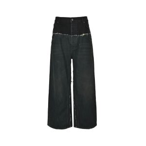 Balenciaga Cut-Up Baggy Denim Jeans in Faded Black (7) Front view of the Balenciaga Cut-Up Baggy Denim pants in faded black, featuring an ultra-wide leg and a frayed horizontal seam.
