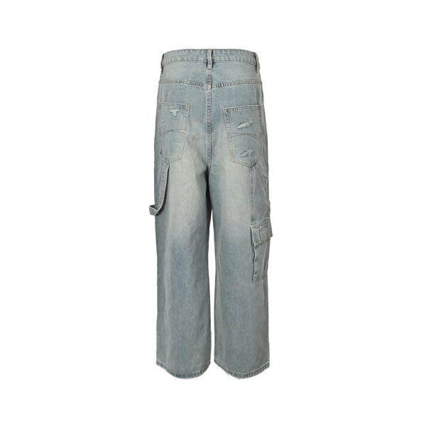 Back view of the faded blue Balenciaga jeans showcasing distressed rear pockets, a left leg hammer loop, and a right leg utility pocket.