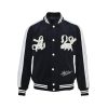 Louis Vuitton Denim Velvet Souvenir Jacket in Midnight Blue and White (7) Front view of the Louis Vuitton souvenir jacket featuring white sleeves, snap buttons, and pearl-embellished lion chest appliqués.