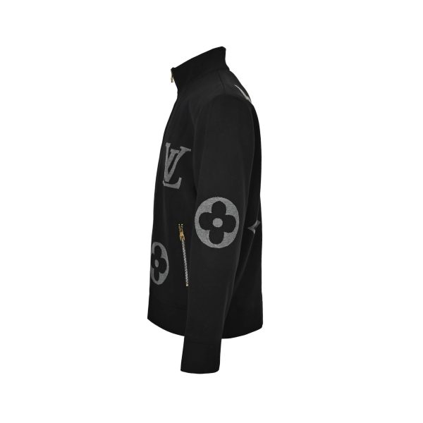 Side profile view of the black Louis Vuitton knit jacket highlighting the ribbed stand collar and continuous monogram motifs on the sleeves.