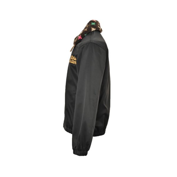 Side profile view of the Louis Vuitton aviator jacket highlighting the sleeve drape, side pocket, and custom chest embroidery.